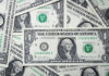Stack of dollar bills, representing fast payouts, a feature that can be found in Betpack's list of sites.